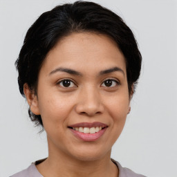 Joyful white young-adult female with medium  brown hair and brown eyes