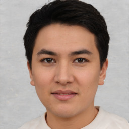 Joyful asian young-adult male with short  black hair and brown eyes