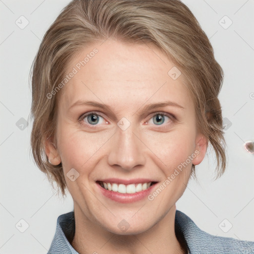 Joyful white young-adult female with medium  brown hair and blue eyes