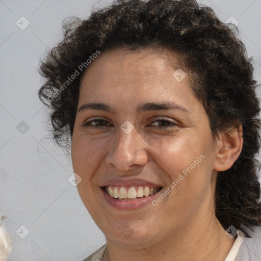 Joyful white adult female with short  brown hair and brown eyes