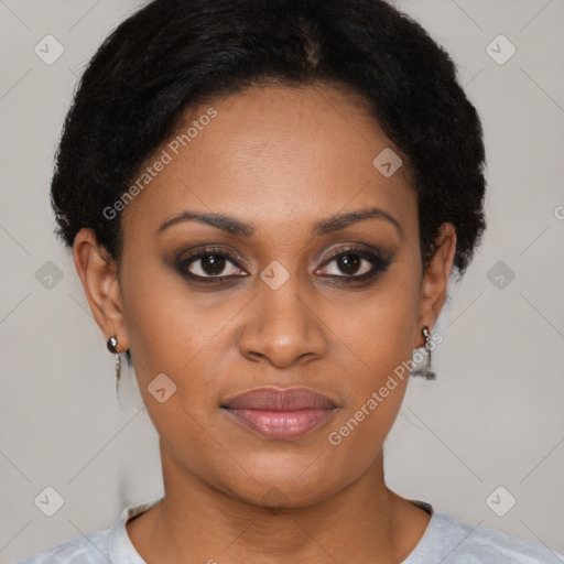 Joyful black young-adult female with short  brown hair and brown eyes