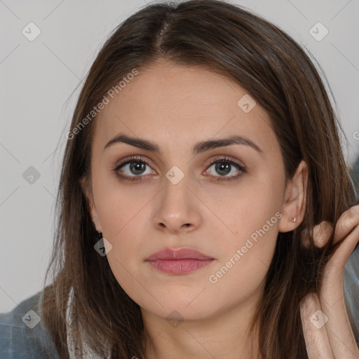 Neutral white young-adult female with long  brown hair and brown eyes