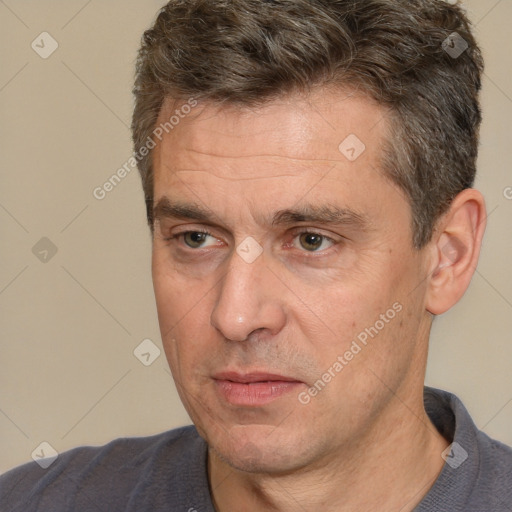 Neutral white adult male with short  brown hair and brown eyes