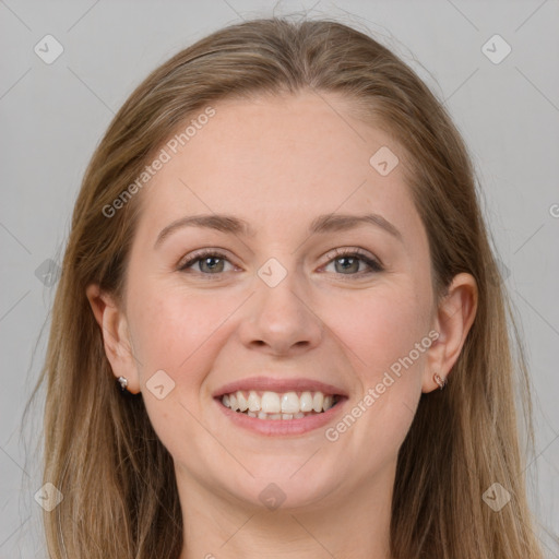 Joyful white young-adult female with long  brown hair and grey eyes