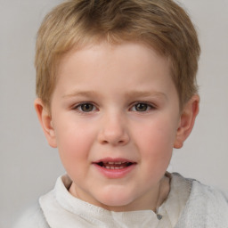 Joyful white child male with short  brown hair and brown eyes