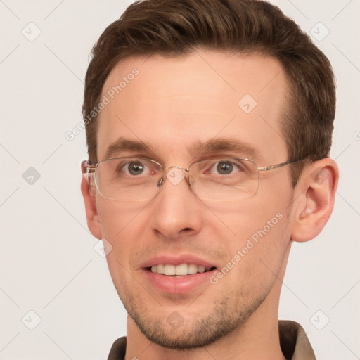 Joyful white adult male with short  brown hair and grey eyes