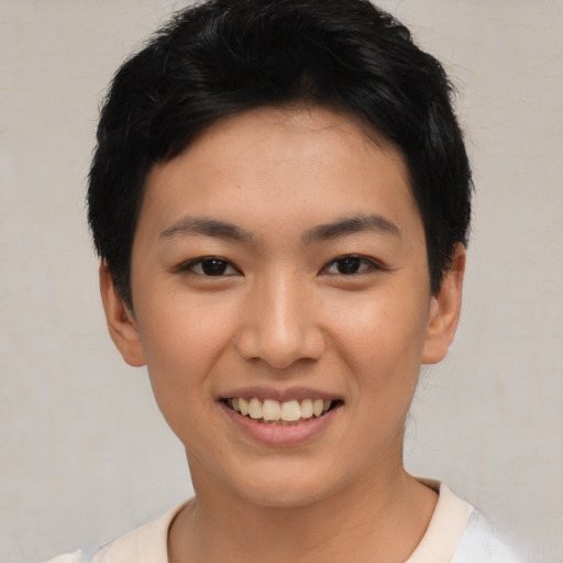 Joyful asian young-adult female with short  black hair and brown eyes