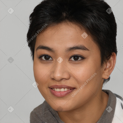 Joyful asian young-adult female with short  brown hair and brown eyes