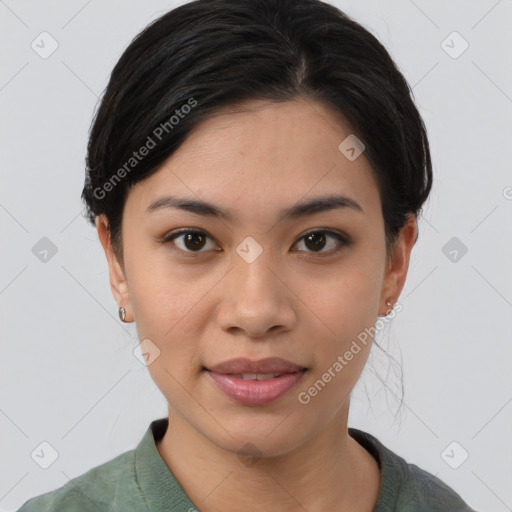 Joyful asian young-adult female with short  black hair and brown eyes