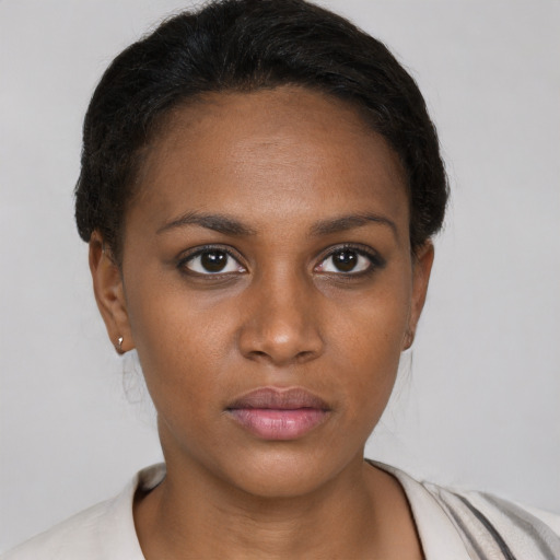 Neutral black young-adult female with short  brown hair and brown eyes