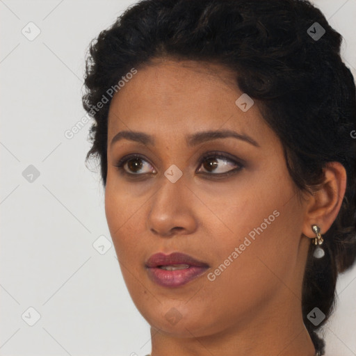 Neutral black young-adult female with long  brown hair and brown eyes