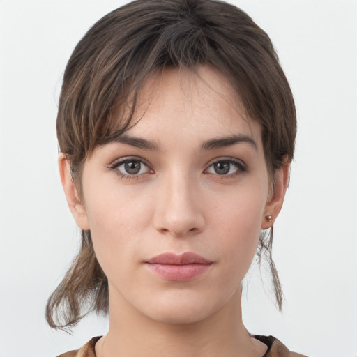 Neutral white young-adult female with medium  brown hair and grey eyes