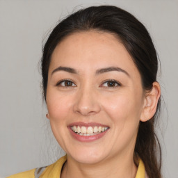 Joyful white young-adult female with medium  brown hair and brown eyes