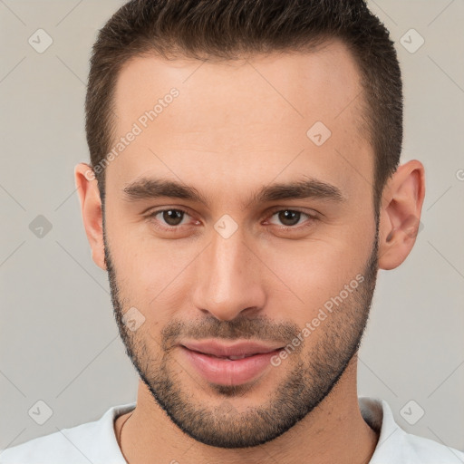 Joyful white young-adult male with short  brown hair and brown eyes