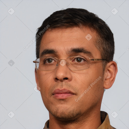 Neutral white adult male with short  black hair and brown eyes