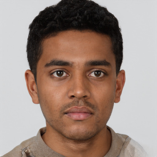 Neutral black young-adult male with short  brown hair and brown eyes