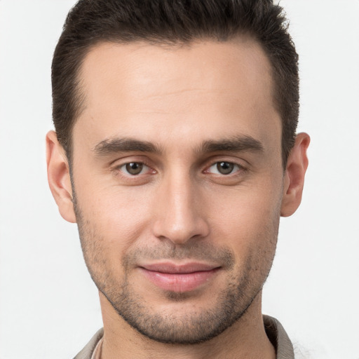 Joyful white young-adult male with short  brown hair and brown eyes