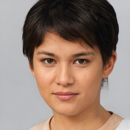 Joyful white young-adult female with short  brown hair and brown eyes