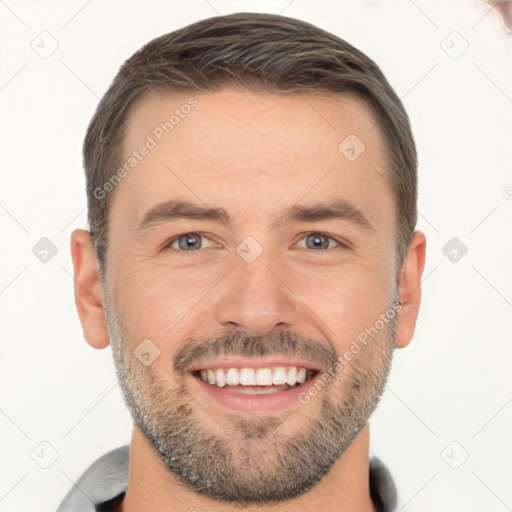 Joyful white young-adult male with short  brown hair and brown eyes