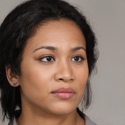 Neutral latino young-adult female with medium  brown hair and brown eyes