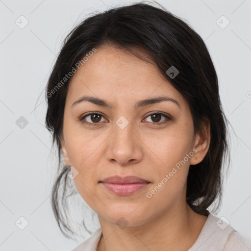 Joyful latino young-adult female with medium  brown hair and brown eyes