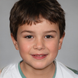 Joyful white child male with short  brown hair and brown eyes