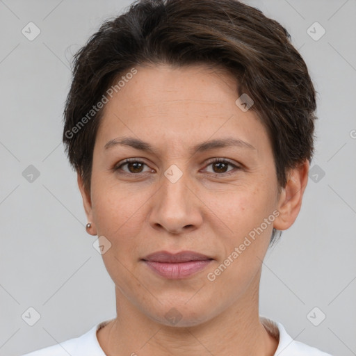 Joyful white adult female with short  brown hair and brown eyes