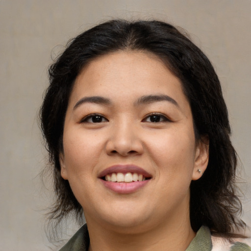 Joyful asian young-adult female with medium  brown hair and brown eyes