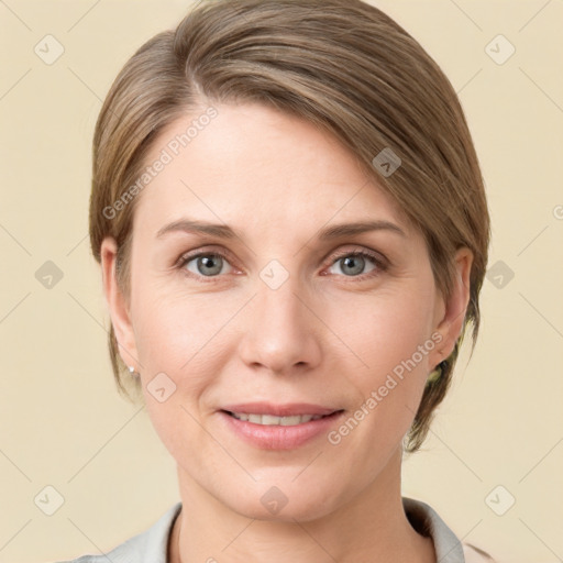 Joyful white young-adult female with medium  brown hair and grey eyes