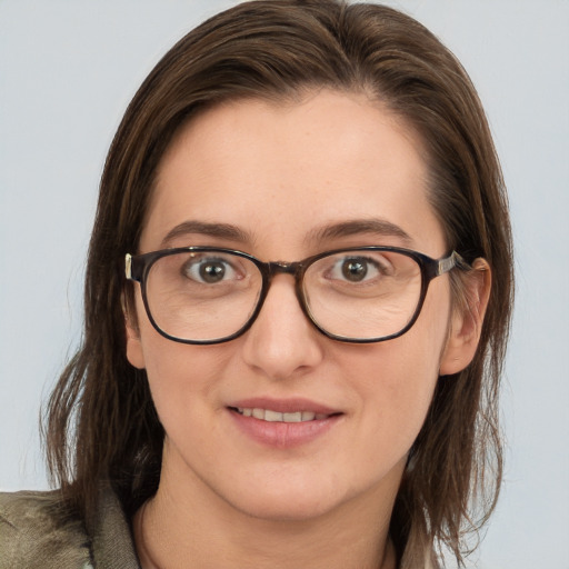 Joyful white young-adult female with medium  brown hair and blue eyes