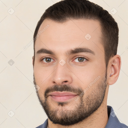 Neutral white young-adult male with short  brown hair and brown eyes