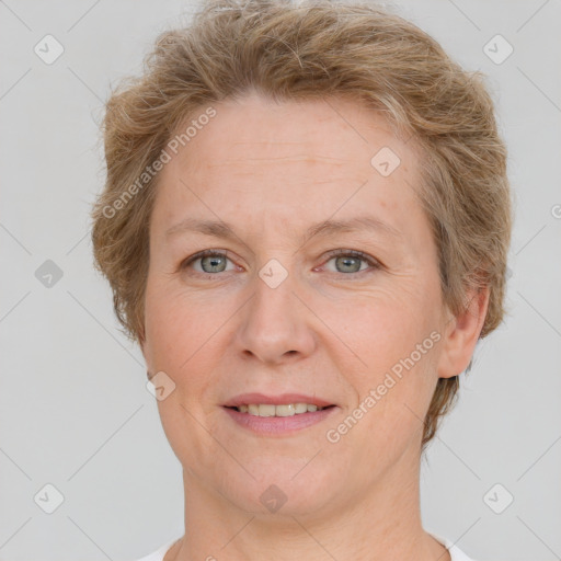 Joyful white adult female with short  brown hair and grey eyes