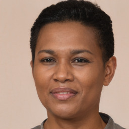 Joyful latino young-adult female with short  black hair and brown eyes