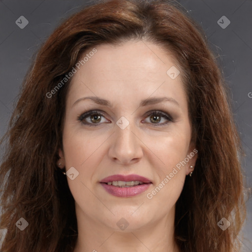 Joyful white adult female with long  brown hair and brown eyes