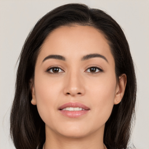 Joyful white young-adult female with medium  brown hair and brown eyes