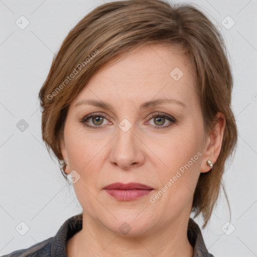 Joyful white adult female with medium  brown hair and grey eyes