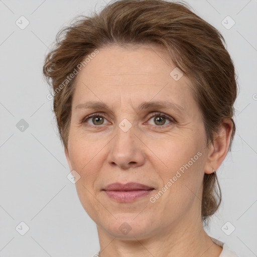 Joyful white adult female with short  brown hair and brown eyes