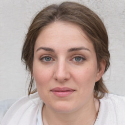 Joyful white young-adult female with medium  brown hair and blue eyes