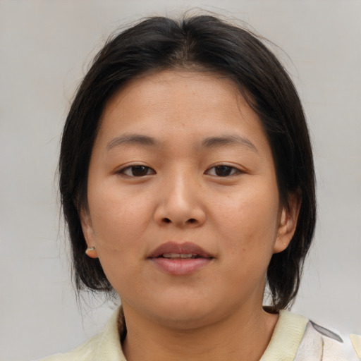 Neutral asian young-adult female with medium  brown hair and brown eyes