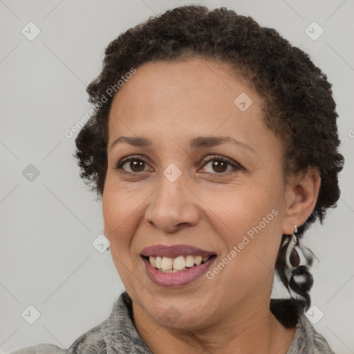 Joyful black adult female with short  brown hair and brown eyes