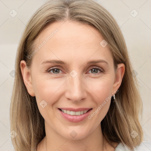 Joyful white adult female with medium  brown hair and grey eyes