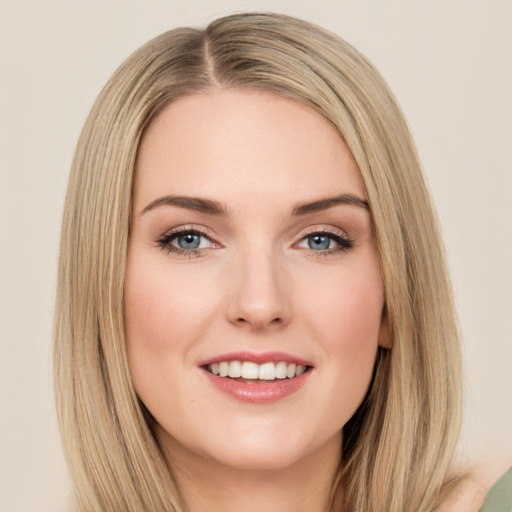 Joyful white young-adult female with long  brown hair and green eyes