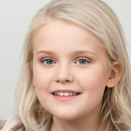 Joyful white child female with medium  brown hair and blue eyes