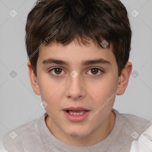 Joyful white child male with short  brown hair and brown eyes