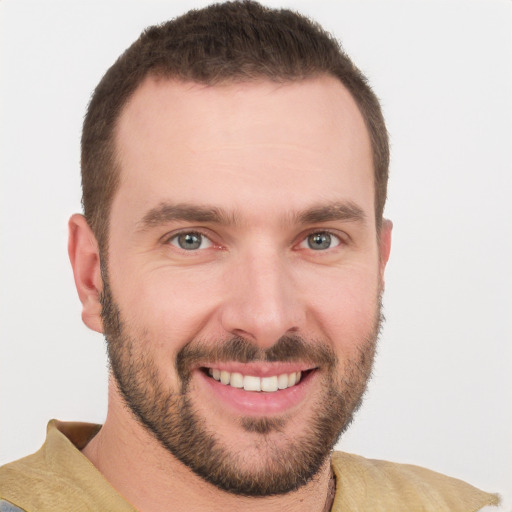 Joyful white young-adult male with short  brown hair and brown eyes