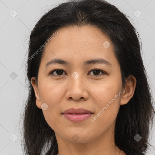 Joyful asian young-adult female with long  brown hair and brown eyes