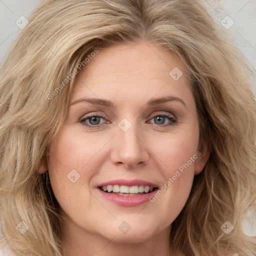 Joyful white young-adult female with long  brown hair and green eyes