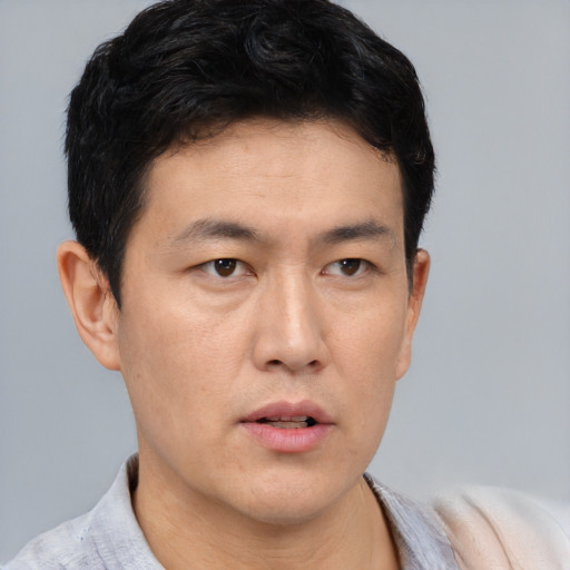 Neutral asian young-adult male with short  black hair and brown eyes