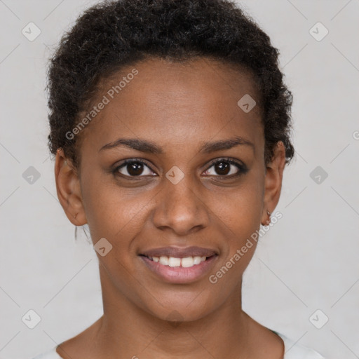 Joyful black young-adult female with short  brown hair and brown eyes