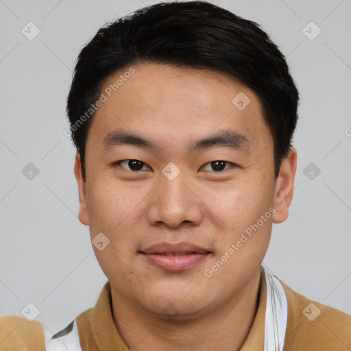 Joyful asian young-adult male with short  black hair and brown eyes